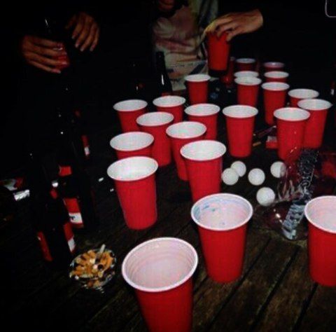 many red cups are sitting on the table