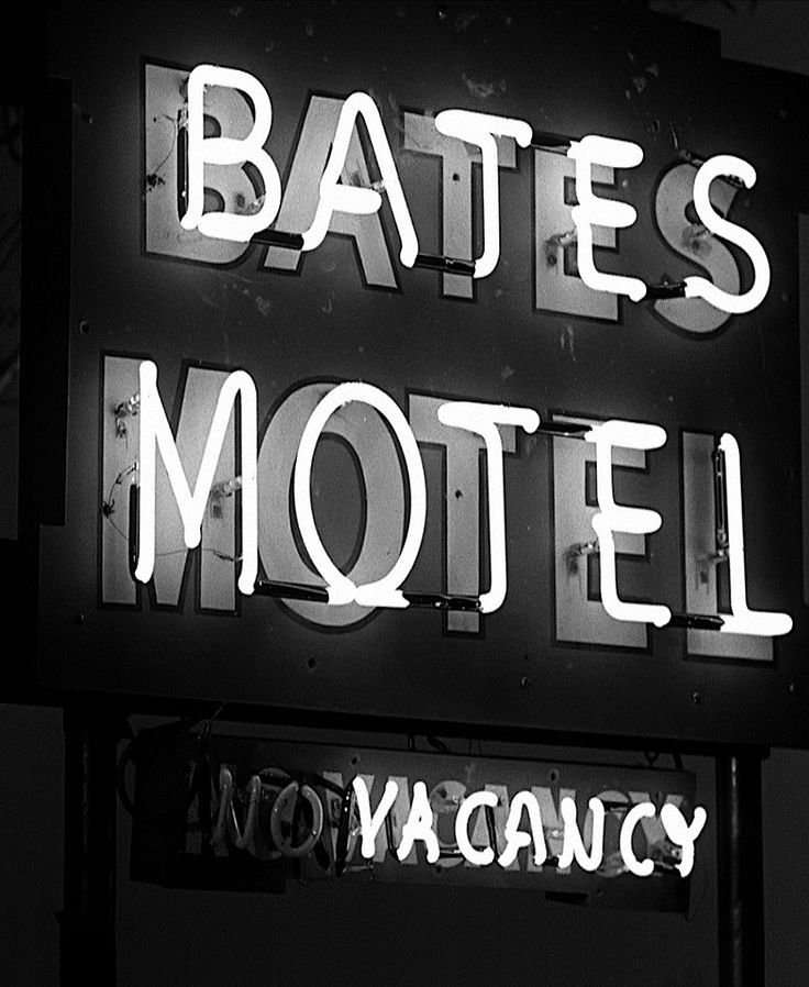 a neon sign that says bates motel and no vacancy on the side of it