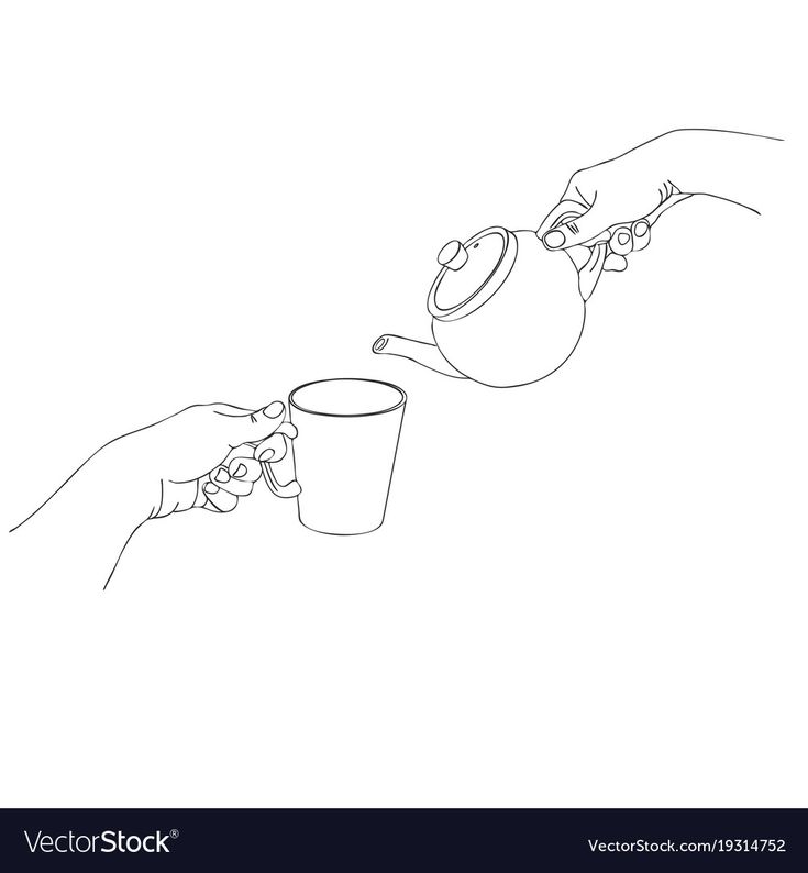 two hands are pouring tea into a cup