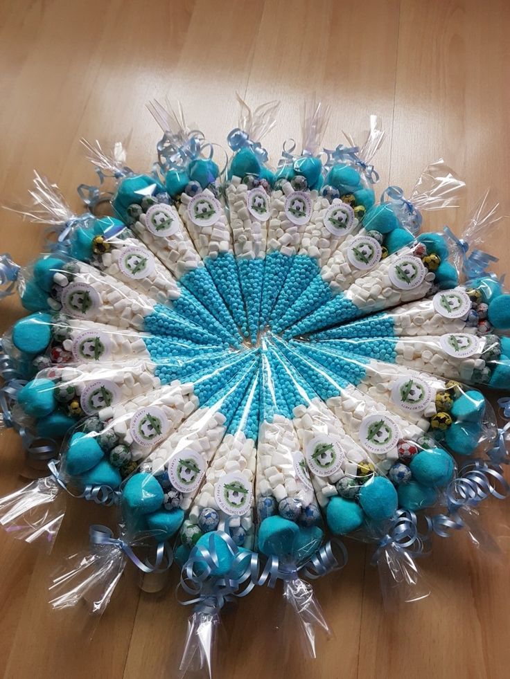 a blue and white decorative item sitting on top of a wooden floor