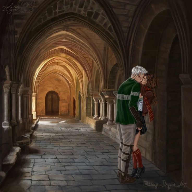 an older man and young woman are kissing in the middle of a stone walkway between two archways