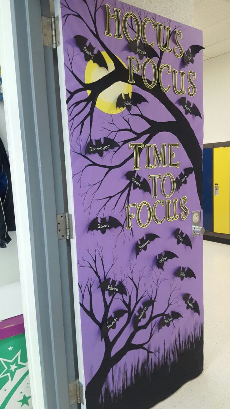 a door decorated with bats and the words hoccus's focus time to focus