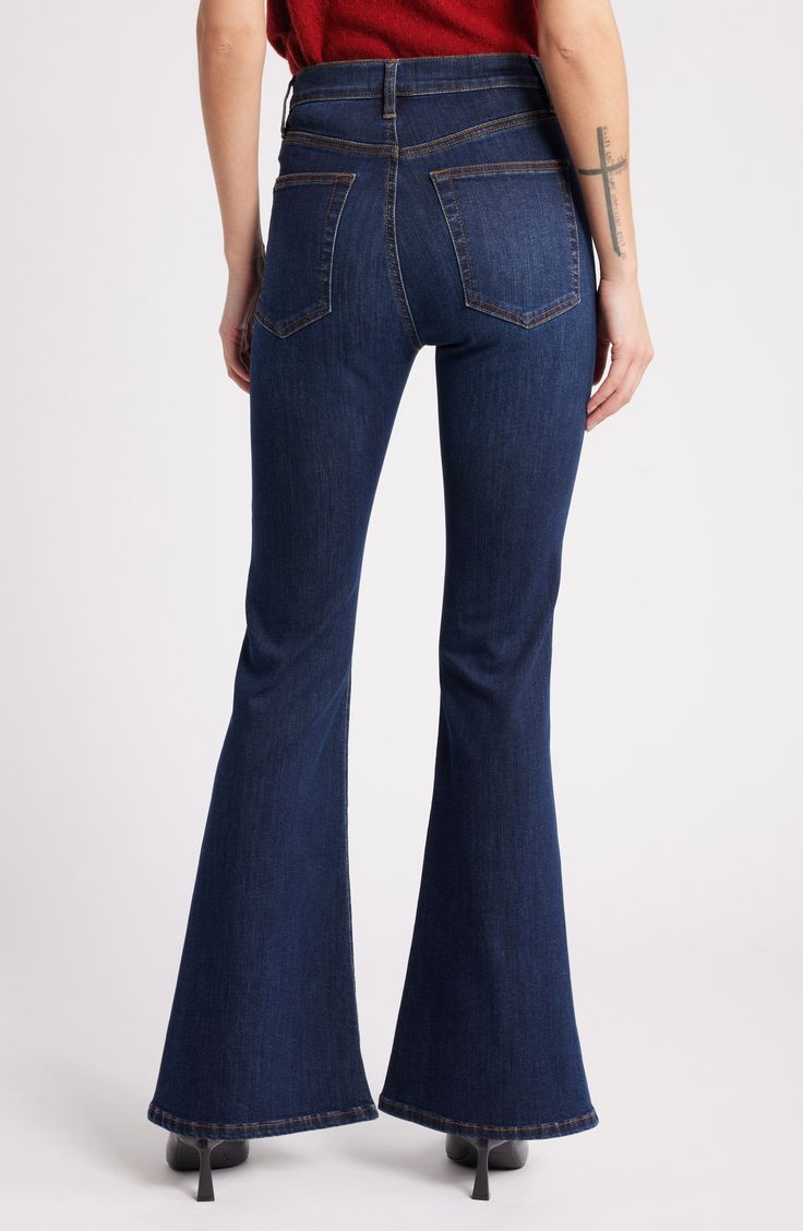 A high-rise waist balances the flared silhouette of dark-wash jeans crafted from lightweight, stretch-kissed denim. 31" inseam; 22" leg opening; 10 1/2" front rise Zip fly with button closure Five-pocket style 93% cotton, 5% polyester, 2% elastane Machine wash, dry flat Made in Turkey Fall Dark Wash Straight Leg Flares, Dark Wash Flared Hem Bottoms For Fall, Dark Wash Flares With Five Pockets For Fall, Dark Wash Denim Jeans With Flared Hem, Classic Dark Wash Flare Bottoms, Dark Wash Flared Hem Flares For Fall, Spring Dark Wash Flare Jeans With Flared Hem, Spring Dark Wash Flares With Five Pockets, Dark Wash Full-length Flares For Fall