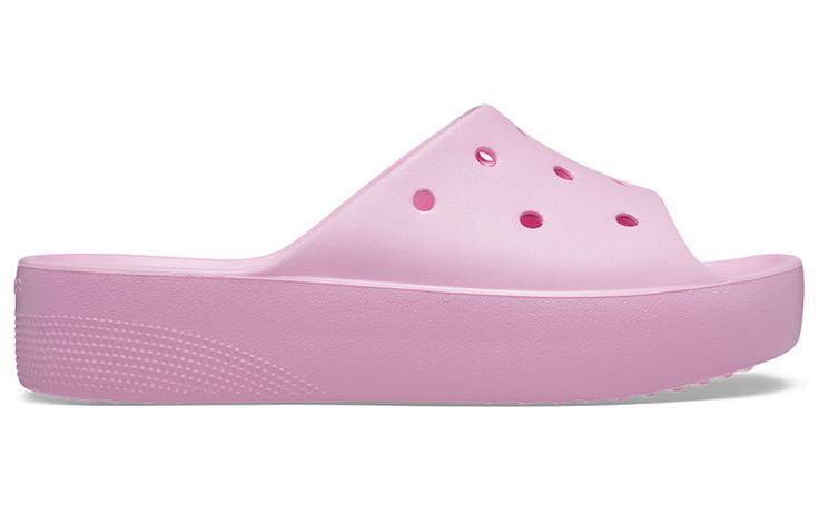 a pair of pink shoes with holes on the upper part and bottom part are shown