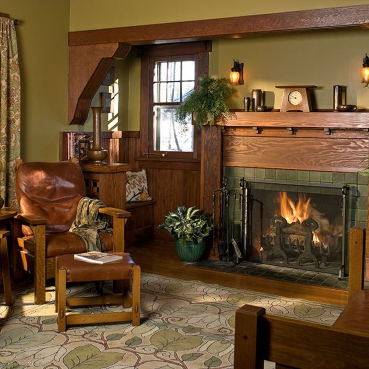 a living room filled with furniture and a fire place in the middle of a room