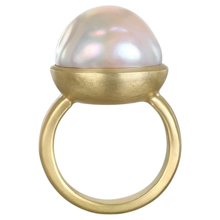 Faye Kim's 18 Karat Gold Cream Baroque Freshwater Pearl Ring is bezel set and highlights the classic beauty of pearls made wearable for today's contemporary styles. Pearl: 17.5mm Size: 7.5 (Can be resized) Photos show variations on ring, all sold separately. Please inquire for more info. Made in the USA Jewel Of The Seas, Freshwater Pearl Ring, Gold Cream, Dream Board, Shrek, Classic Beauty, Pearl Ring, Cocktail Rings, Bezel Setting