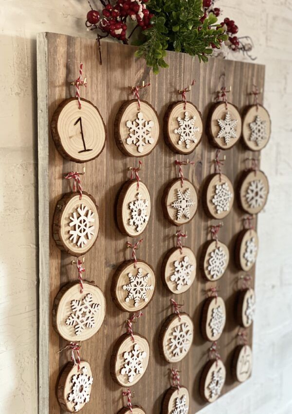 a wooden wall hanging with ornaments on it