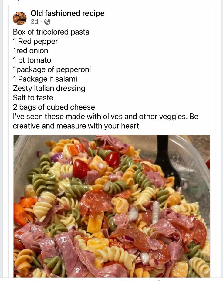 a bowl filled with pasta and meat on top of a table