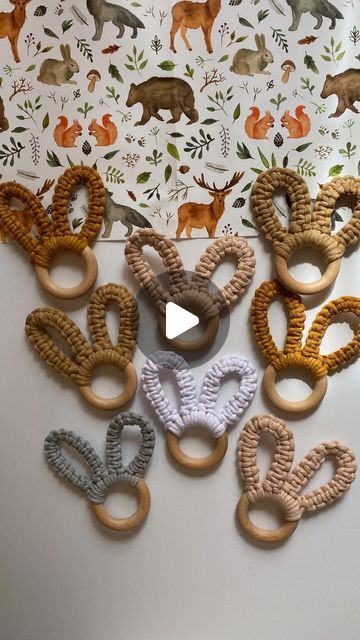 several wooden rings are arranged in the shape of animals on a white background with deers and leaves