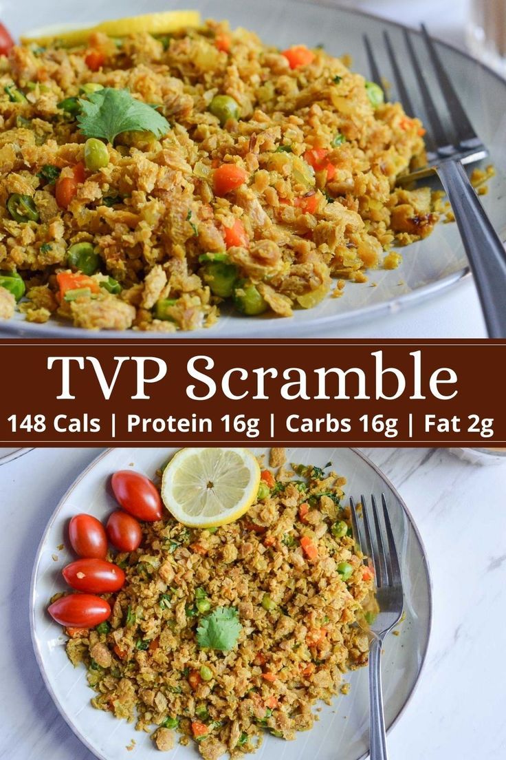 two plates filled with rice and vegetables on top of a white tablecloth next to a fork