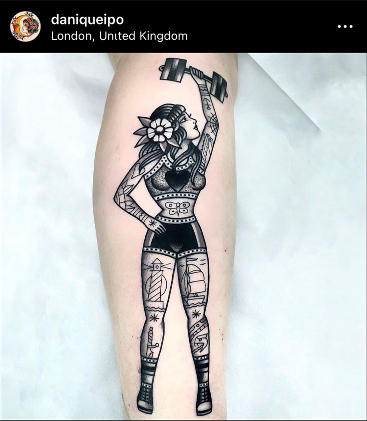 a woman with a hammer in her hand and tattoos on her leg, holding a flower