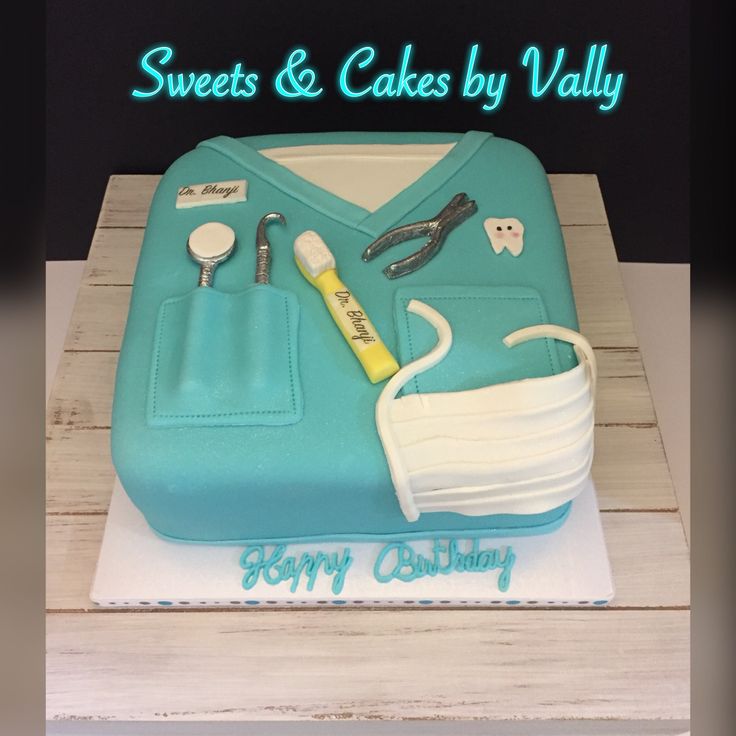 a cake that is shaped like a nurse's uniform and medical supplies on it