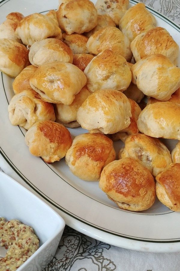 a white plate topped with lots of pastry