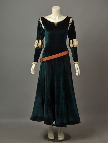 a green velvet dress with gold trimmings on the shoulders and cuffs, circa - 1950