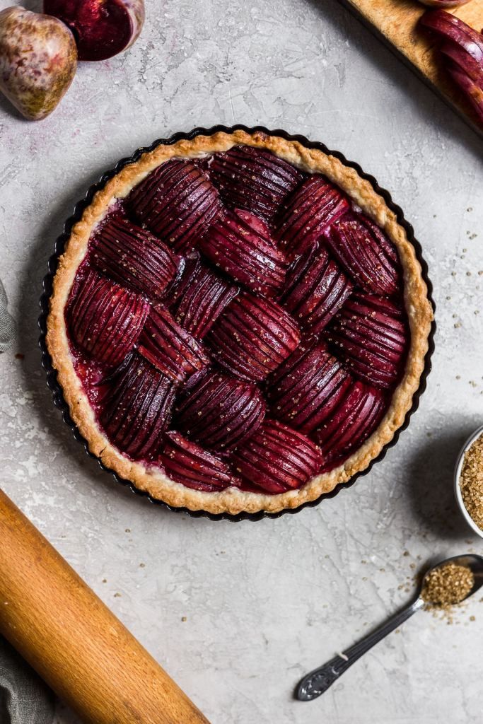 there is a pie that has been cut into pieces and placed on the table next to it