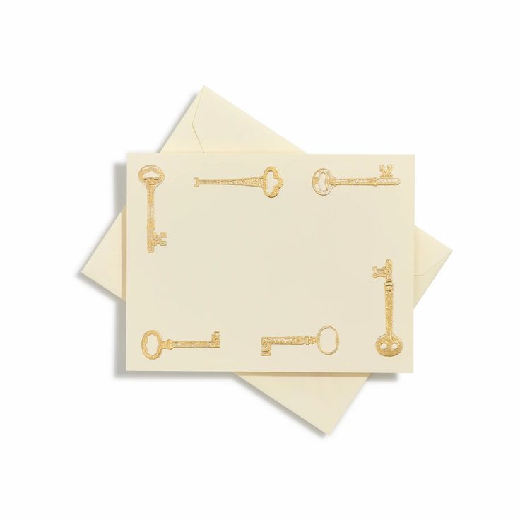 two envelopes with gold keys on them