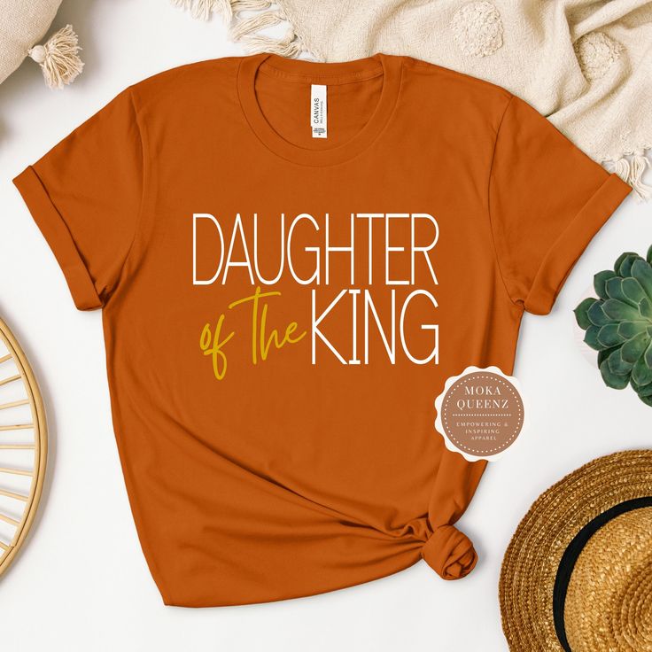 Shop this beautifully designed Daughter of the King Christian Shirt Today. Our Christian T Shirt  is soft and comfy. You won't want to take it off. This religious Tshirt would make the perfect gift for a woman of God.  It is made with 100% ring-spun cotton. Available in sizes S-3X Unisex sizes.  UNISEX FIT offers a relaxed fit that works well for women and men. TIP: Choose a size down in Unisex if you prefer a more fitted silhouette (e.g., if you are a Ladies XL, choose Unisex L) This is a must- Faith Tshirts, Woman Of God, Daughter Of The King, King Shirt, Daughters Of The King, Christian T Shirt, Easter Shirt, Stylish Shirt, Christian Music