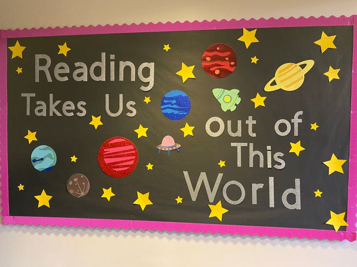 a bulletin board with writing on it that says reading takes us out of this world