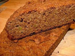 a loaf of bread sitting on top of a wooden cutting board