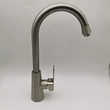 a kitchen faucet that is on the counter