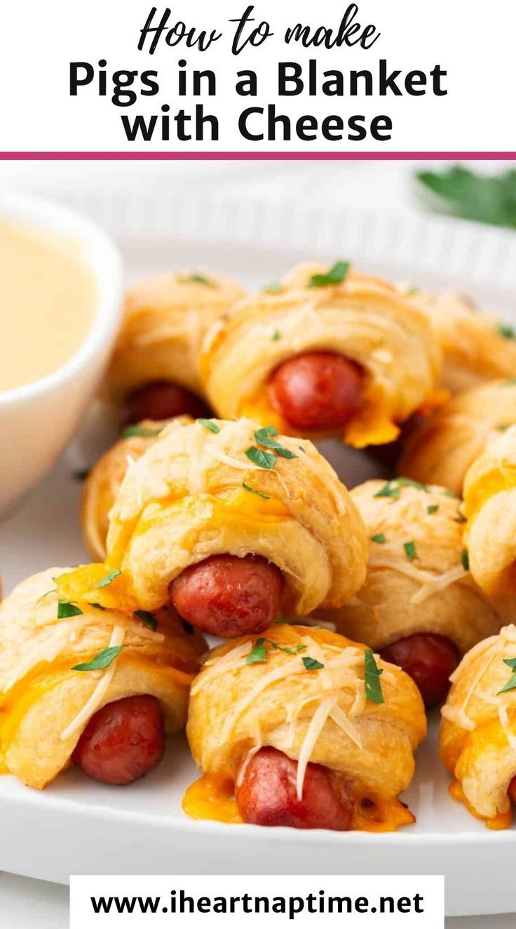 pigs in a blanket with cheese on a white plate