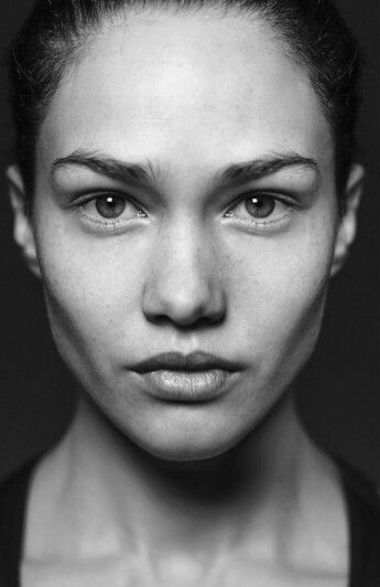 a black and white photo of a woman's face