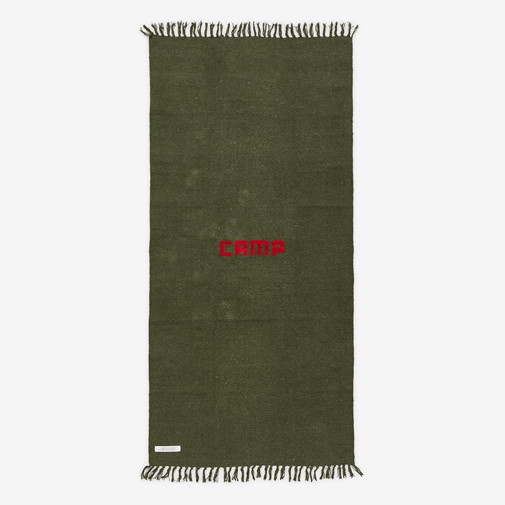 a green scarf with red lettering on it