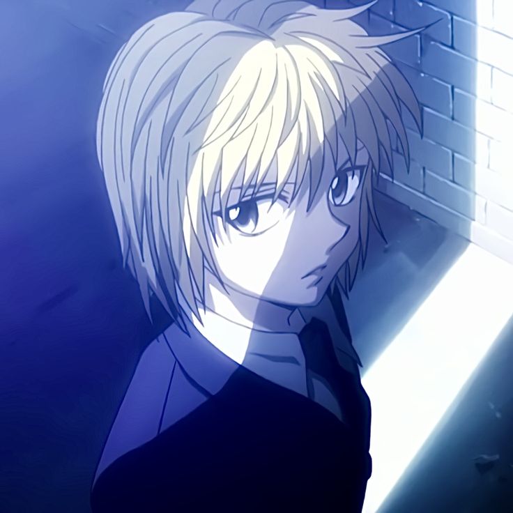 an anime character with blonde hair standing in front of a brick wall and looking at the camera