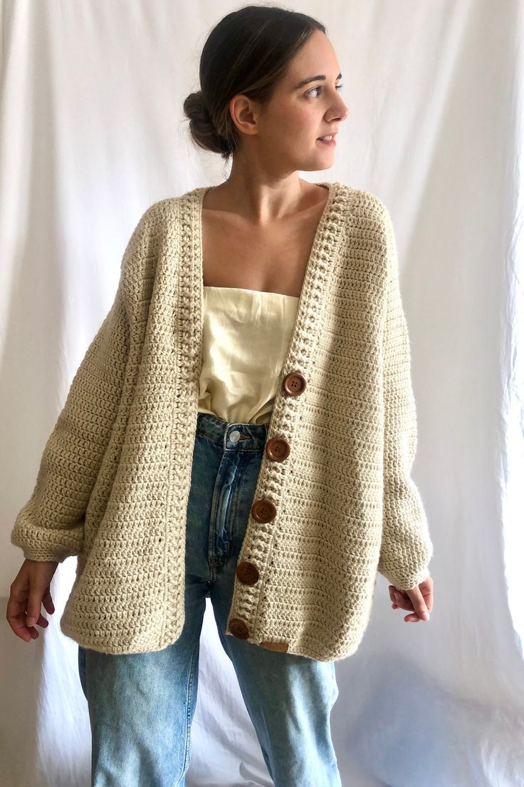 This Beige Oversized cardigan, has a gorgeous V neckline and is 100% handmade. This wool cardigan has a beautiful clousure with gorgeous dark wooden buttons. This hand crocheted jacket is made with hight quality yarn, antiallergic and super super soft. This amazing oversize cardigan is the gargment that you would want wear it forever! Perfect to wear it with dresses or with a jean! Super comfy, stylish and versatile! WHICH IS MY SIZE? This cardigan is One size fits all (S-L).  If you are not sure if it fits you, here you have the measurements of the back and the lenght. The width from shoulder to shoulder is 55 cm/21,6 in and length 75 cm/29,5 in.  If you can't find your size or you are not sure about the size, contact me and I will make the one that fits your measurements. HOW TO KEEP YOU Beige Chunky Knit Cotton Cardigan, Cozy Cream Crochet Sweater, Oversized Knitted Beige Outerwear, Casual Hand Knitted Beige Outerwear, Winter Beige Handmade Cardigan, Beige Crochet Sweater For Fall, Crochet Cream Cardigan For Fall, Winter Handmade Beige Cardigan, Handmade Beige Cardigan For Winter