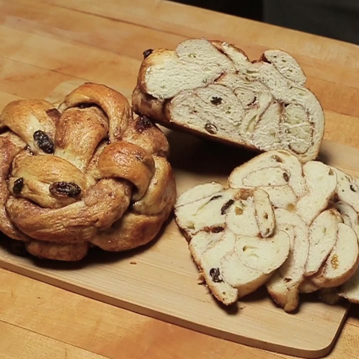 three different types of bread on a cutting board