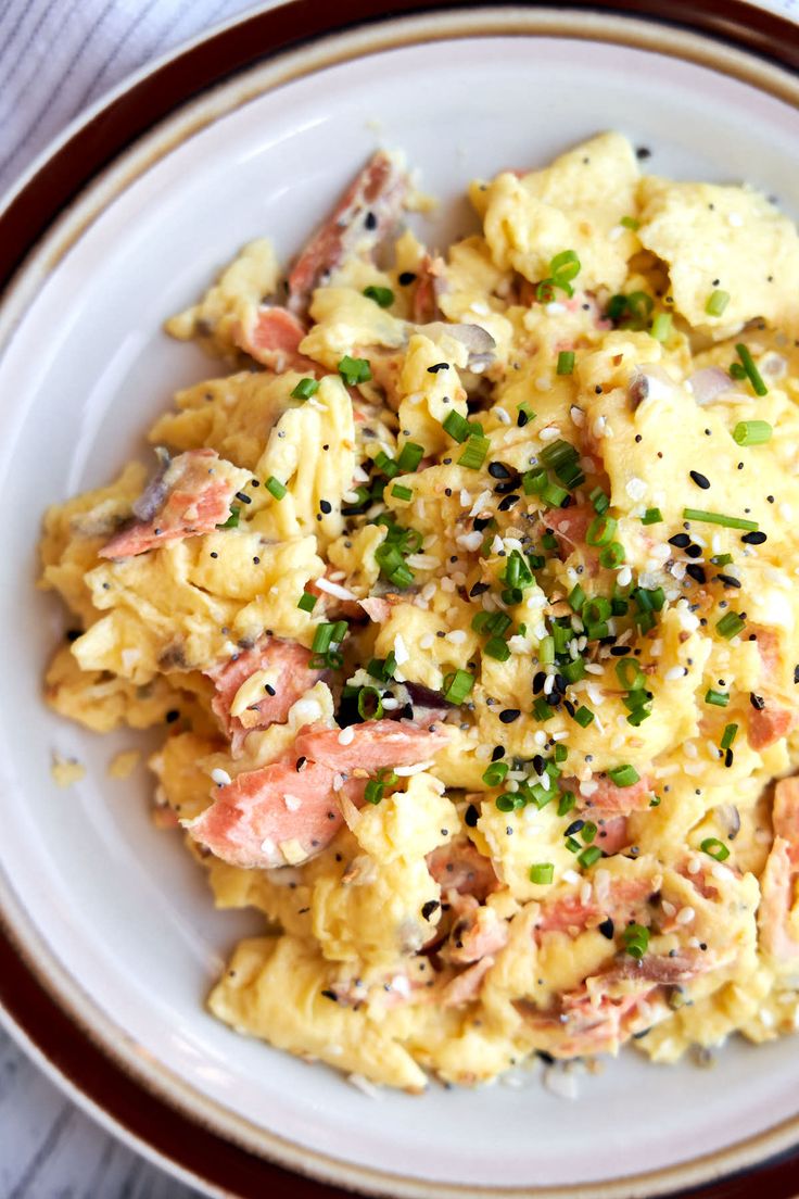 a white bowl filled with food on top of a table