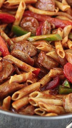 pasta with sausage and peppers in a pan