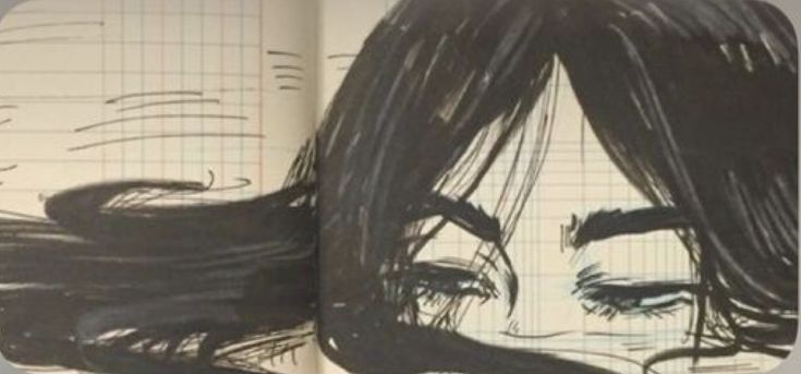 an open book with a drawing of a woman's face