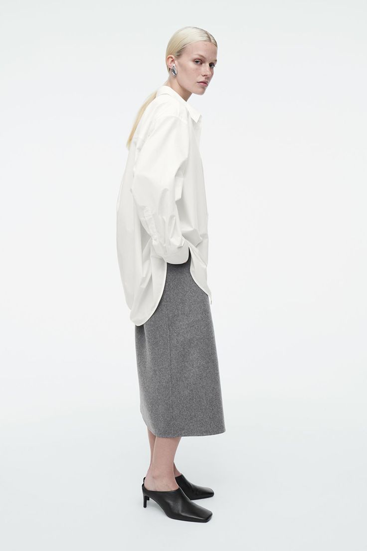 OVERSIZED CURVED-HEM SHIRT - WHITE - Shirts - COS Modern Oversized Collared Shirt, Elegant Oversized Shirt With Pockets, Oversized Shirt With Concealed Placket, Oversized Workwear Shirt With Concealed Placket, Oversized Shirt With Spread Collar, Oversized Cotton Shirt With Concealed Placket, Oversized Straight Hem Tops For Work, Oversized Tops With Straight Hem For Work, Oversized Top With Concealed Placket For Fall