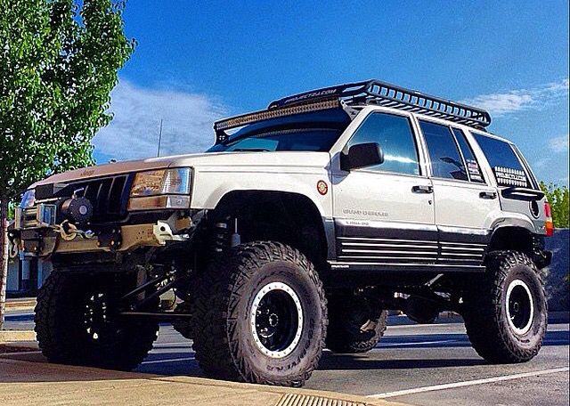 an off road vehicle parked in a parking lot