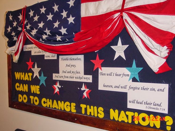 a bulletin board with red, white and blue stars on it that says what can we do to change this nation?