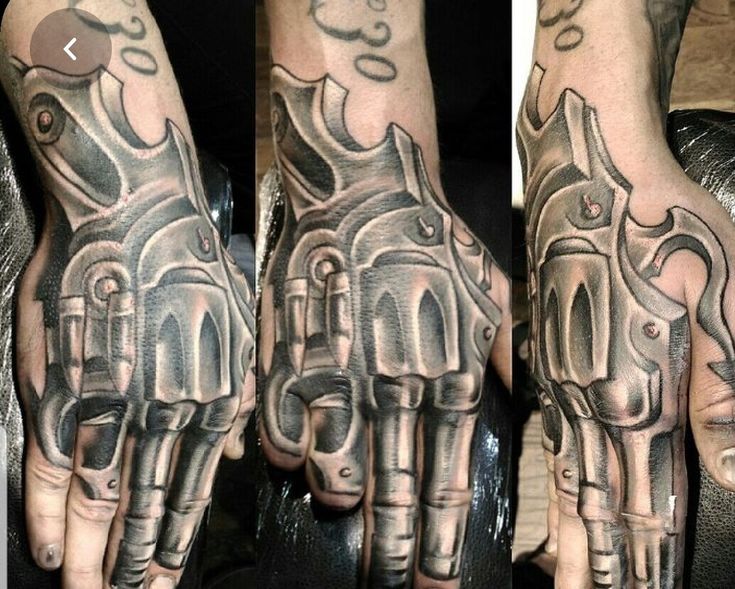 two hands that have tattoos on them and one has a motorcycle engine in the middle