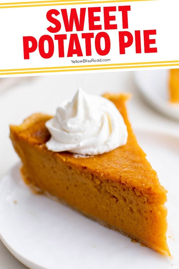 a slice of sweet potato pie on a white plate with whipped cream in the middle