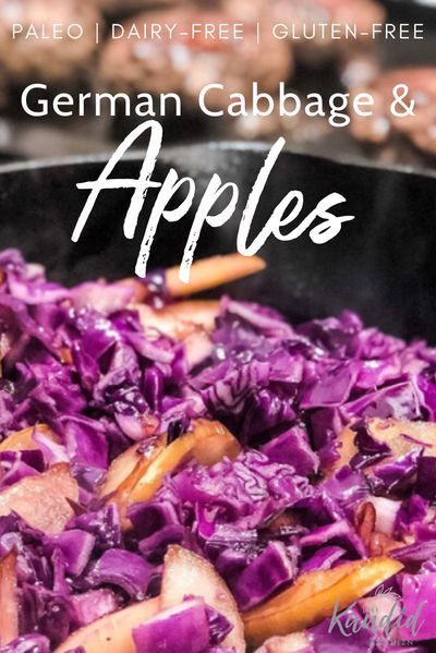 a pan filled with red cabbage and carrots on top of a table next to other food