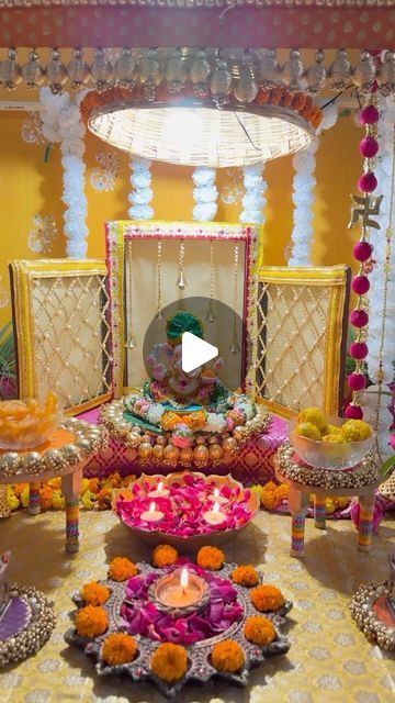 a decorated stage with flowers, candles and decorations for a wedding or other function in india