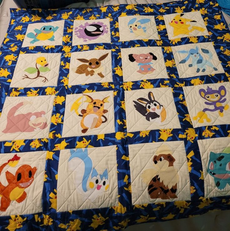 a quilted blanket with many cartoon characters on it