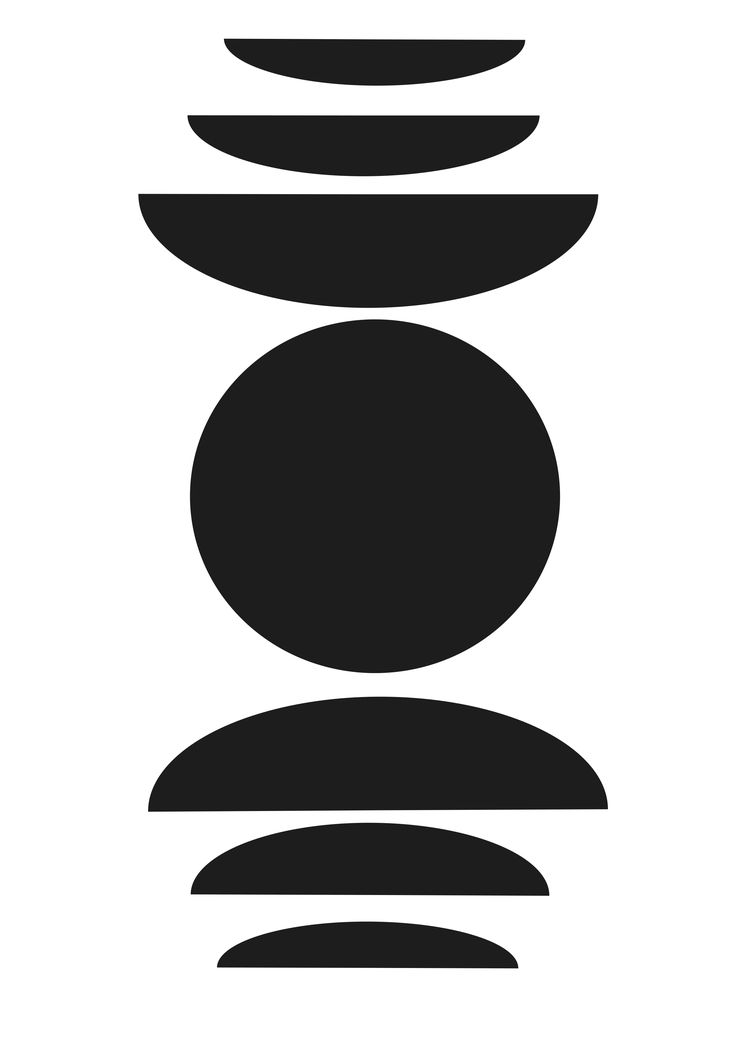 a black and white image of rocks stacked on top of each other in the shape of a circle