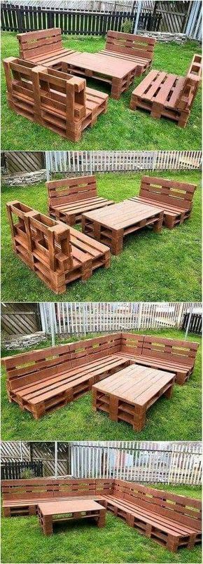 some wooden benches sitting in the grass