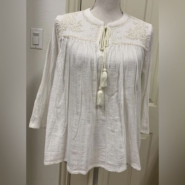 In Excellent Condition No Damages Pit To Pit Is 20” Total Length Of Blouse Is 24” Smoke Free Home Bundle 2 Or More Items To Save!!!! Bohemian Embroidered Long Sleeve Top With Lace Trim, White Peasant Top With Lace Trim, White Casual Tunic Peasant Top, Embroidered Peasant Top For Spring Daywear, White Peasant Top For Daywear, Bohemian Long Sleeve Embroidered Top For Daywear, Peasant Style Beach Top With Embroidered Hem, Spring Folk Tops With Lace Trim, Peasant Long Sleeve Embroidered Top For Beach