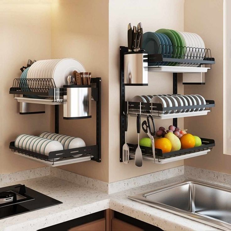 the dish rack is organized with dishes and utensils in this modern kitchen setting