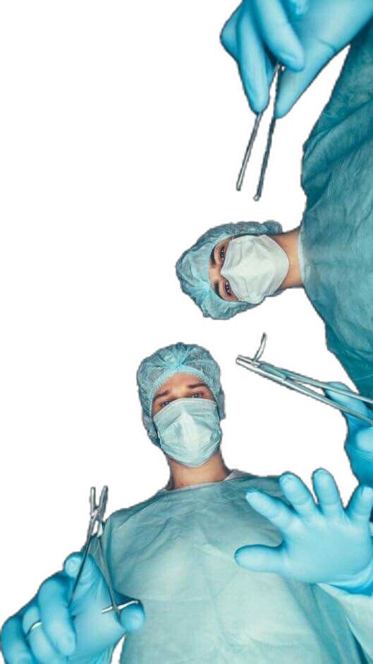 two surgeons are performing surgery on an injured patient