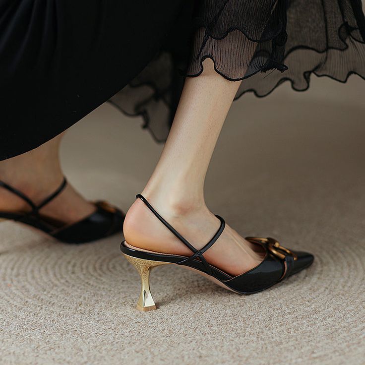 These black kitten heels are the perfect addition to your wardrobe. With their square toe and slingback design. they are both stylish and comfortable. The patent leather gives them a sleek and polished look. while the gold chain adds a touch of glamour.Whether you're dressing up for a special occasion or just adding a touch of elegance to your everyday look. these shoes are sure to make you feel confident and beautiful. Upper: Cow Leather Lining: Leather Outsole: Rubber Toe: Square Toe Closure: Heels With Gold Chain, Natural Leather Sandals, Slingback Kitten Heels, Ankle Wrap Heels, Black Kitten Heels, Beautiful Heels, Zipper Heels, Black Kitten, Square Toe Heels