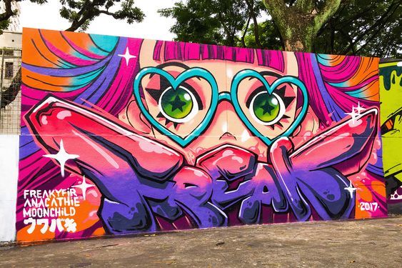 a large colorful graffiti wall with green eyes and heart shaped glasses on it's face