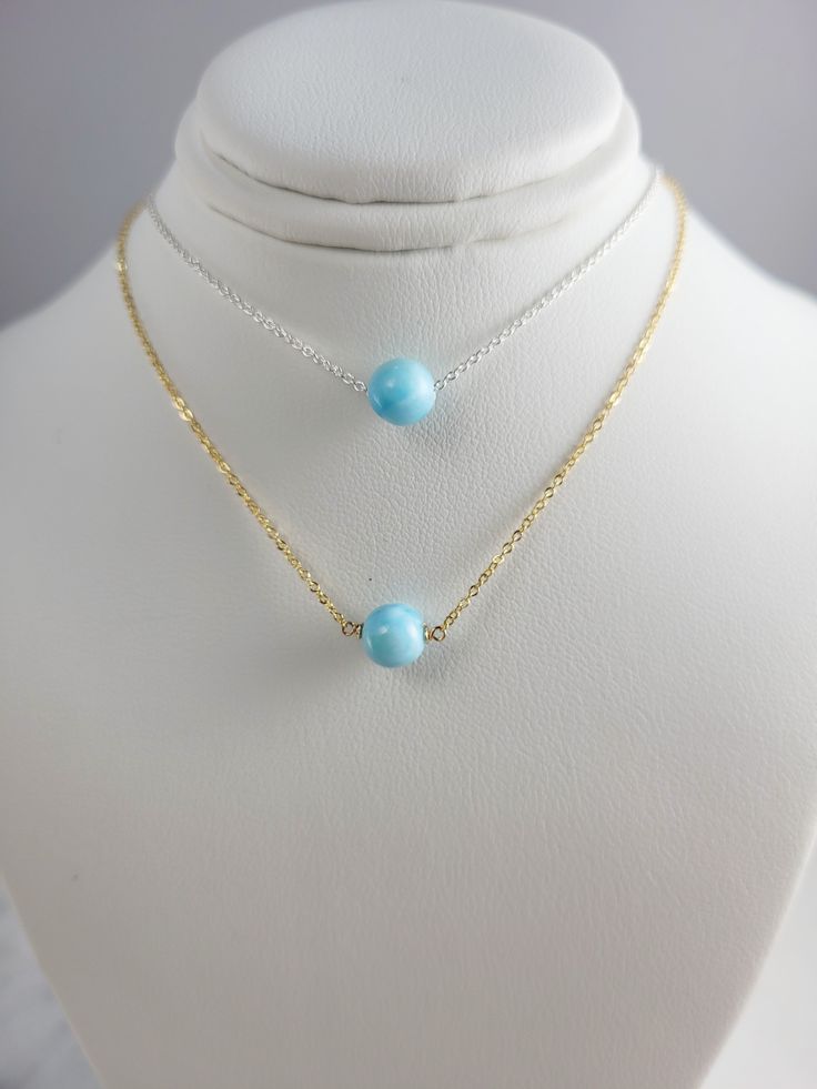 This dainty handmade necklace features a natural Larimar gemstone wrapped on a chain. This delicate choker necklace is beautiful worn alone or layered with other necklaces. A classic and simple everyday piece that will make fashion look effortless. Customize yours by choosing your metal and length. This necklace design is also available in different gemstones. Makes a great gift to add to any gemstone lover's collection. Perfect to gift for Christmas, Valentine's Day, Mother's Day, and more! Gem Delicate Choker Necklace, Delicate Choker, Make Fashion, Larimar Jewelry, Necklace Design, Ball Necklace, Gift For Christmas, Handmade Necklace, Necklace Designs