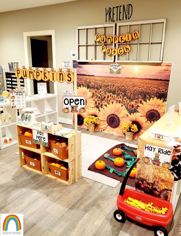 an open store with sunflowers and oranges on display